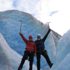 a man standing on top of a snow covered mountain