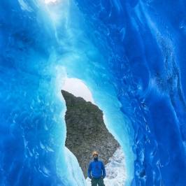 a man riding a wave on top of a mountain