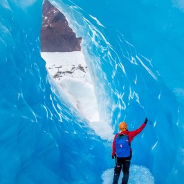 a man riding a wave on a surfboard in the water