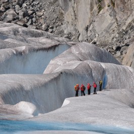 a man riding on the back of a large rock
