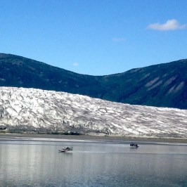 a body of water with a mountain in the background