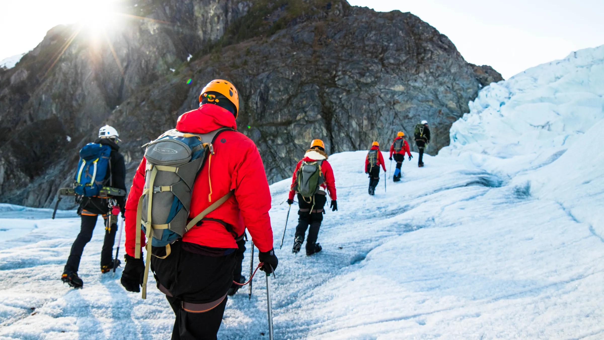 IMG_0573 a group of people riding skis on a snowy mountain
