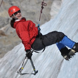 a man riding skis down a snow covered slope