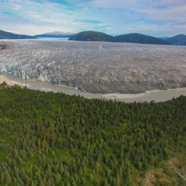 a body of water with a mountain in the background