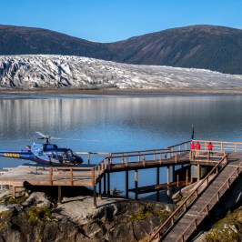 a group of people in a boat on a body of water