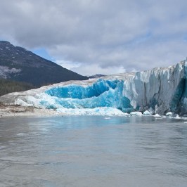 water next to a mountain
