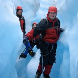 a man riding skis down a snow covered slope