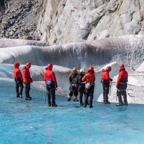 a group of people walking in the snow