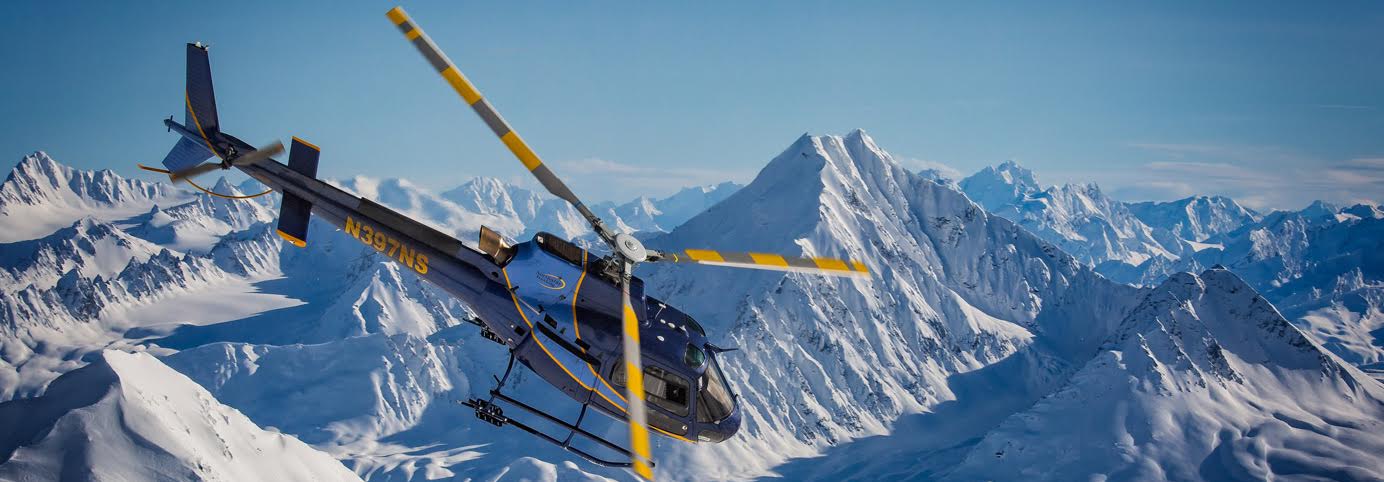 a plane flying over a snow covered mountain a plane flying over a snow covered mountain