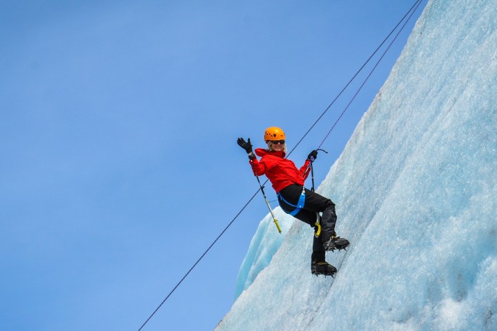 a man flying through the air while riding skis
