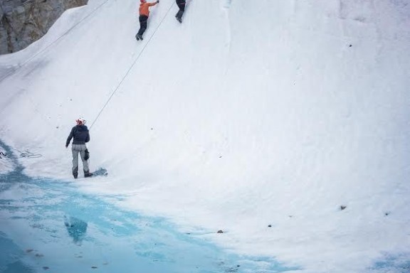 a group of people skiing down a mountain